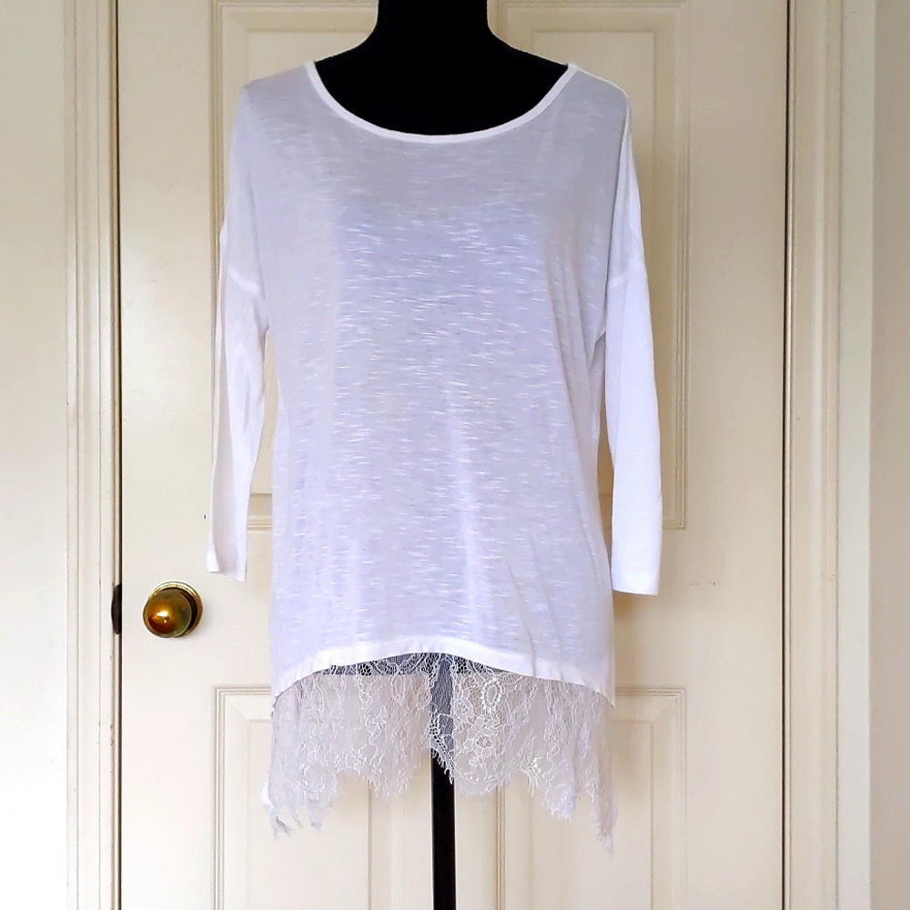 NWOT. 100% Rayon Loose Fit 3/4 sleeve Top with lace edge and 12" side opening.